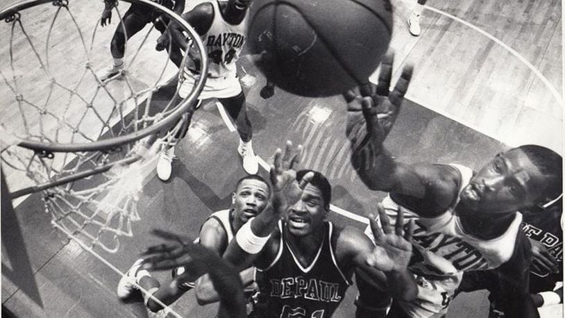 Anthony Grant (right) shoots against DePaul in a February 1986 game. DAYTON DAILY NEWS ARCHIVE