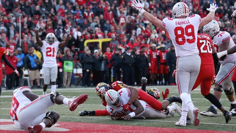 COLLEGE PARK, MD - NOVEMBER 17: Dwayne Haskins #7 of the Ohio State Buckeyes scores a touchdown against the Maryland Terrapins during overtime to win at Capital One Field on November 17, 2018 in College Park, Maryland. (Photo by Will Newton/Getty Images)