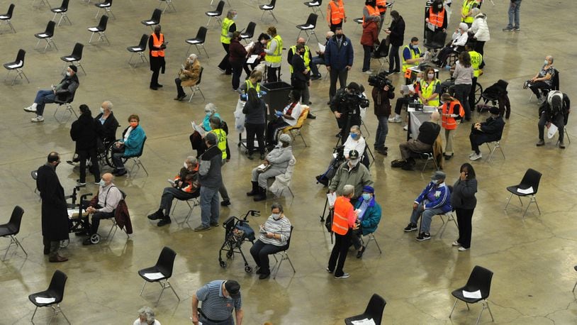 Hundreds of people arrived at the Dayton Convention Center Wednesday morning, Jan. 20, 2021, for the COVID-19 vaccination.