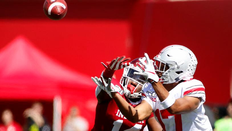 BLOOMINGTON, INDIANA - SEPTEMBER 14: Chris Olave #17 of the Ohio State Buckeyes attempts to catch a ball while being defended by Andre Brown Jr. #14 of the Indiana Hoosiers during the second quarter at Memorial Stadium on September 14, 2019 in Bloomington, Indiana. (Photo by Justin Casterline/Getty Images)