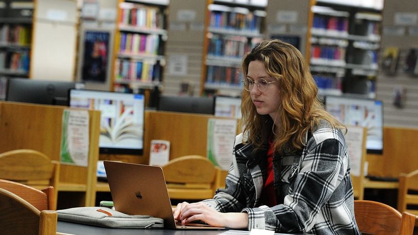 Samantha Schneider works inside the Xenia branch of the Greene County Public Library, Friday March 17, 2023. MARSHALL GORBY\STAFF