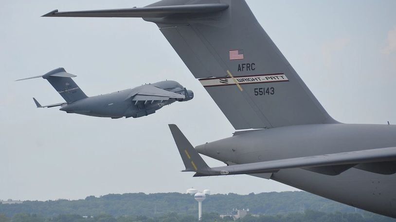 A C-17 Globemaster III aircraft takes off from a runway on August 15, 2020, at Wright Patterson Air Force Base. This particular C-17 is part of the 445th Airlift Wing, home to nine C-17s and nearly 2,000 Reserve Citizen Airmen. (U.S. Air Force photo by Staff Sgt. Ethan G. Spickler)