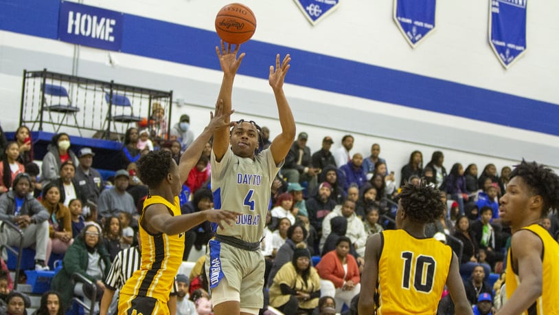 Dunbar's Antaune Allen shoots over Meadowdale's Kalerrio Reaves during their Dec. 13 game before a packed crowd at Dunbar. Contributed photo/Jeff Gilbert