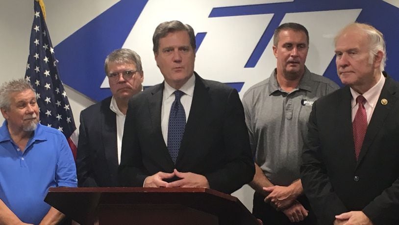 Rep. Mike Turner, R-Dayton, speaks in August at an event at Fuyao. At far right is Rep. Steve Chabot. Turner and Chabot dwarf their opponents in terms of fundraising this campaign cycle. Turner had $377,592 in his campaign account as of Sept. 30, while Chabot had $1.1 million. Chabot’s Democratic opponent, Michele Young, had $68,903 on hand, while neither of Turner’s two opponents raised enough money to report to the Federal Elections Commission. Photo contributed by Nate Davis.