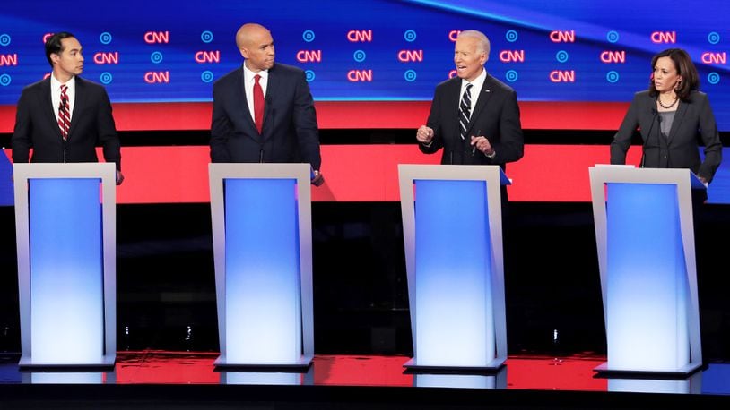 DETROIT, MICHIGAN - JULY 31:  Democratic presidential candidate former Vice President Joe Biden (2nd R)  speaks while Sen. Kamala Harris (D-CA) (R), Sen. Cory Booker (D-NJ) and former housing secretary Julian Castro listen during the Democratic Presidential Debate at the Fox Theatre July 31, 2019 in Detroit, Michigan.  20 Democratic presidential candidates were split into two groups of 10 to take part in the debate sponsored by CNN held over two nights at Detroits Fox Theatre.  (Photo by Scott Olson/Getty Images)