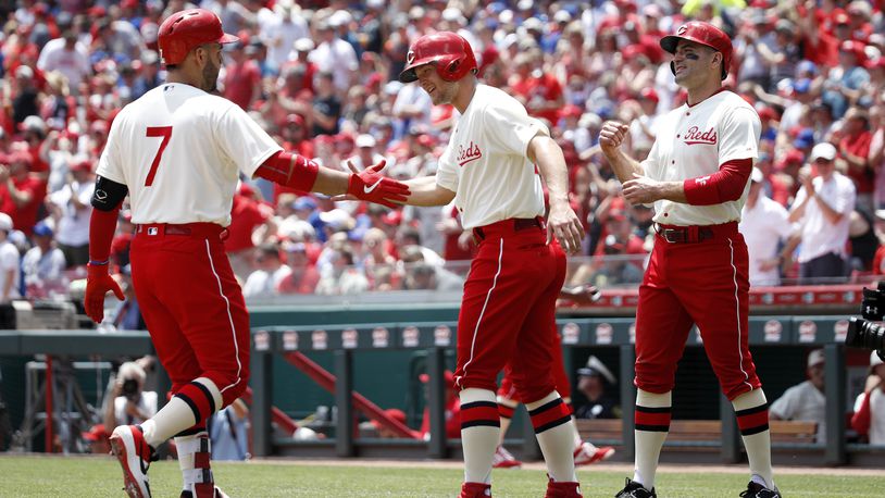CINCINNATI, OH - JUNE 30: Eugenio Suarez #7 of the Cincinnati Reds is congratulated by Nick Senzel #15 after hitting a three-run home run in the first inning against the Chicago Cubs at Great American Ball Park on June 30, 2019 in Cincinnati, Ohio. (Photo by Joe Robbins/Getty Images)