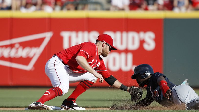 CINCINNATI, OH - JUNE 03: Zack Cozart #2 of the Cincinnati Reds tags out Brandon Phillips #4 of the Atlanta Braves as he tries to steal second base in the sixth inning of a game at Great American Ball Park on June 3, 2017 in Cincinnati, Ohio. The Braves defeated the Reds 6-5 in 12 innings. (Photo by Joe Robbins/Getty Images)