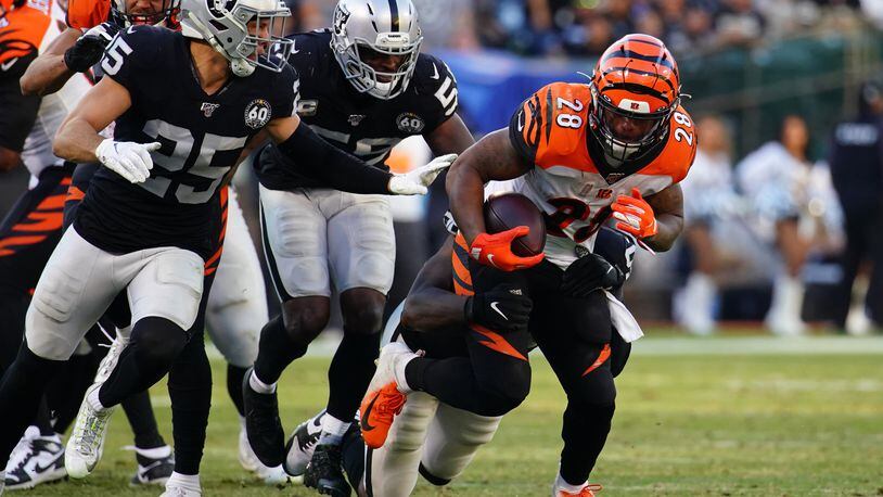 OAKLAND, CALIFORNIA - NOVEMBER 17: Joe Mixon #28 of the Cincinnati Bengals runs the ball during the second half against the Oakland Raiders at RingCentral Coliseum on November 17, 2019 in Oakland, California. (Photo by Daniel Shirey/Getty Images)