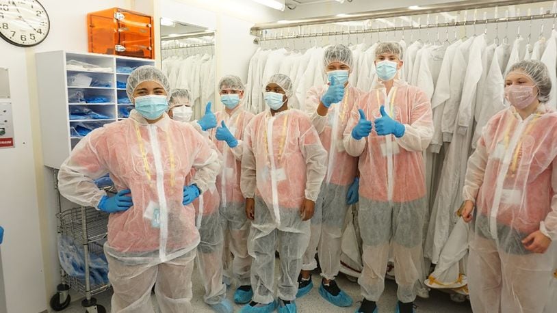 Air Camp students gown up to take a tour of the class 100 clean room at the Air Force Research Laboratory’s Sensors Directorate facility at Wright-Patterson Air Force Base. The students learned about science, technology, engineering and math, or STEM, careers within AFRL during their tour. CONTRIBUTED PHOTO