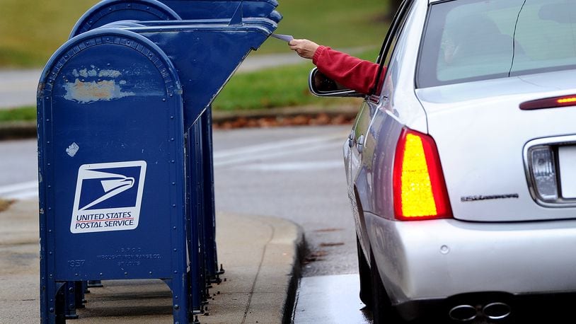 Police found a hidden U.S. Postal Service mailbox key during a traffic stop, leading to the arrest of suspects, according to Oakwood’s mayor. MARSHALL GORBY\STAFF