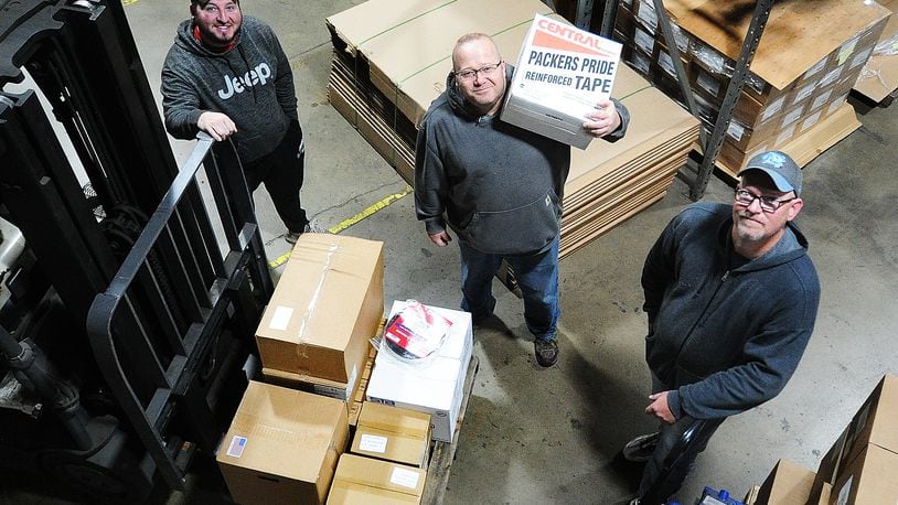 Allied Shipping & Packaging Supplies at 3681 Vance Road in Moraine recently celebrated 40 years in business, all of them in Moraine. Employees (from left to right) Chris Bradley, Donny Vanhoose and Eric Sine pause for a photo during work Wednesday, March 29, 2023. MARSHALL GORBY/STAFF