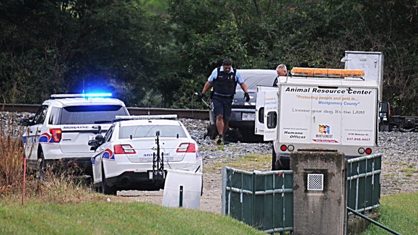 A high-speed chase between Moraine police and a car with a 10-year-old boy inside ended after a fleeing passenger fired at a witness and police before the car dead-ended at a Great Miami River dam, police said. MARSHALL GORBY / STAFF