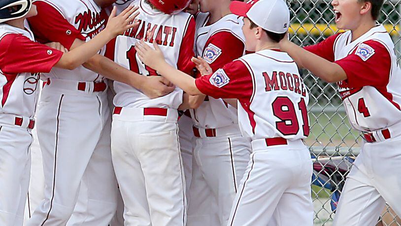 Miami Little League players celebrate a home run during the 2016 Little League District 9 tournament. Due to a lack of volunteers, Miami Little League may be forced to turn over two of its programs to the Oxford Parks and Recreation Department, which would mean forfeiting players’ ties to Little League. FILE PHOTO/2016