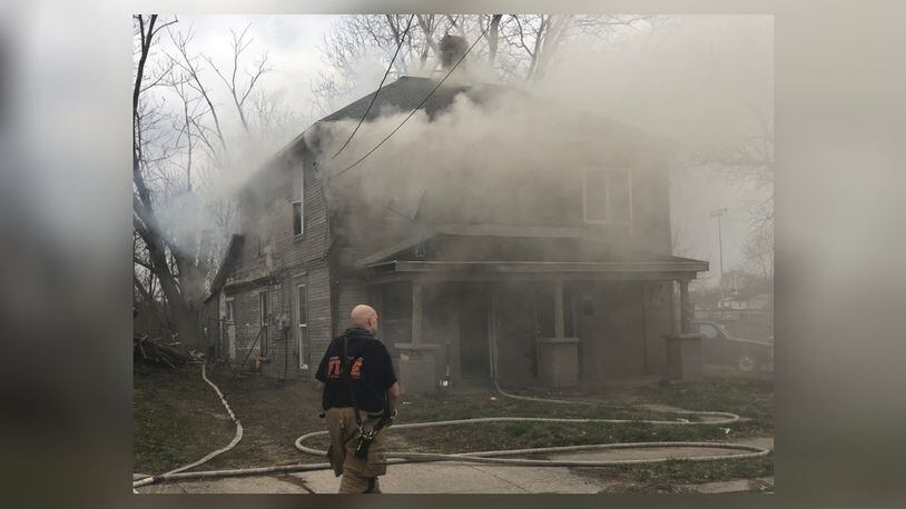Springfield firefighters battle a fire at a duplex in the 1700 block of Clay Street March 12, 2020. BILL LACKEY/STAFF