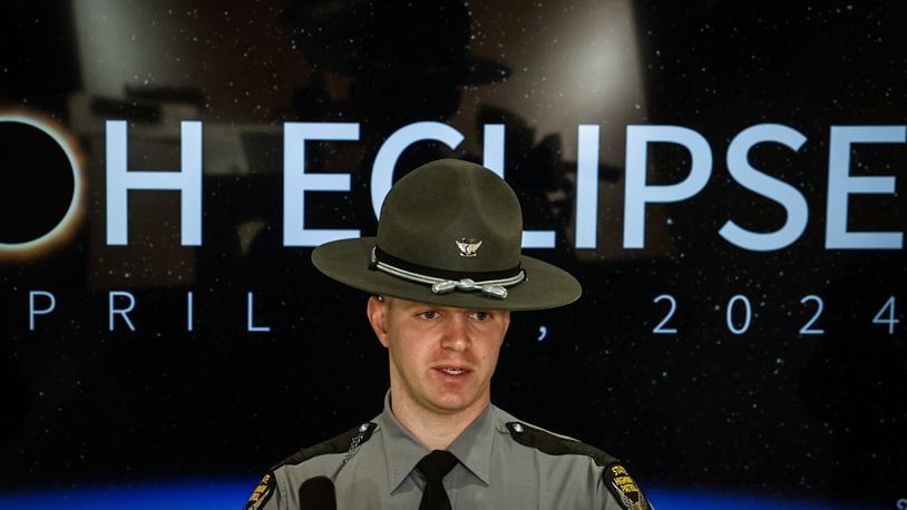 Ohio State Highway Patrol Sgt. Tyler Ross talks to the Dayton and Cincinnati media about being safe on the roads during the April 8 eclipse. JIM NOELKER/STAFF