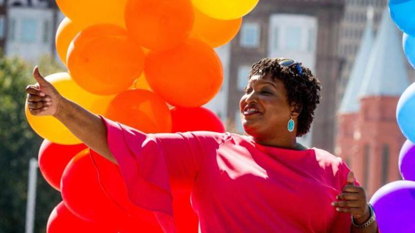 Gubernatorial candidate Stacey Abrams gives a thumbs up to the crowd during the annual Atlanta Pride Parade Sunday in Atlanta on October 14, 2018.