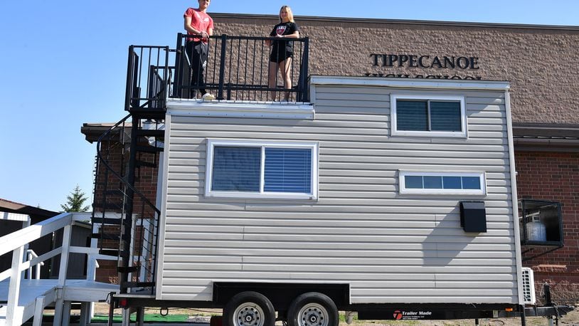 Tippecanoe High School students check out a student-built tiny house scheduled to be auctioned May 30. Contributed