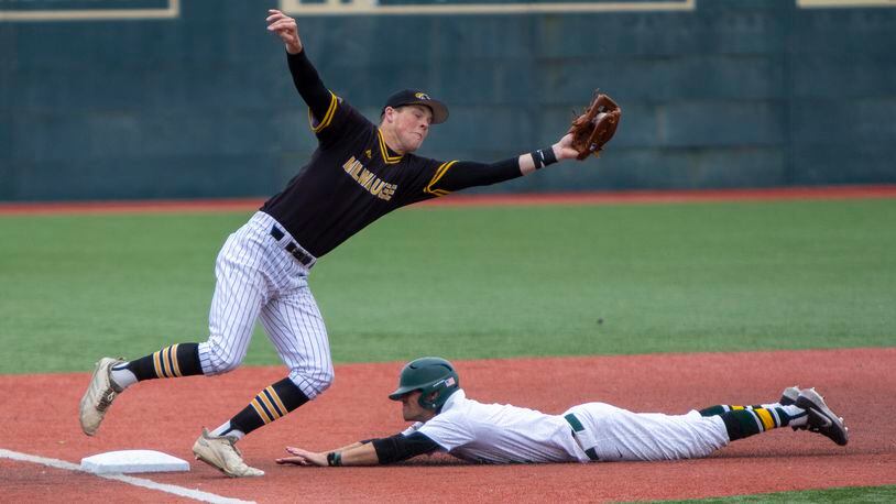 Wright State shortstop Damon Dues steals third base against Milwaukee in the third inning Saturday after hitting a double. Dues homered in fourth to go 4-for-4 with three RBIs, two stolen bases and four runs scored in the first four innings. Jeff Gilbert/CONTRIBUTED