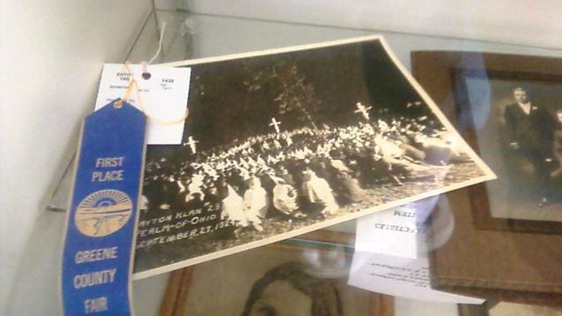 This photo of a 1924 Dayton Ku Klux Klan rally, which won a first-place blue ribbon at the 2013 Greene County Fair, was stripped of its ribbon Tuesday, July 30, 2013. A fair patron snapped the photo, which was part of a juried exhibit, and alerted WHIO-TV.