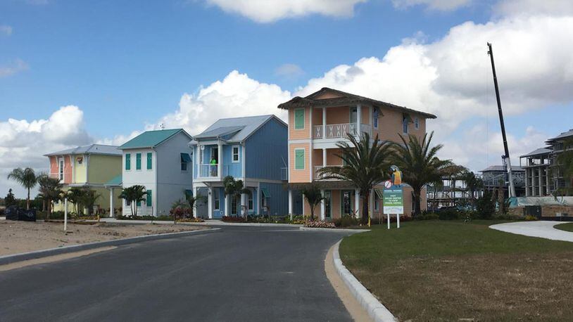 Four model homes stand amid construction in the Key West neighborhood of Margaritaville Resort Orlando, which include 1,000 ‘vacation homes’ alongside a hotel, time-share-units, apartments, retail and water park. (Dewayne Bevil/Orlando Sentinel/TNS)