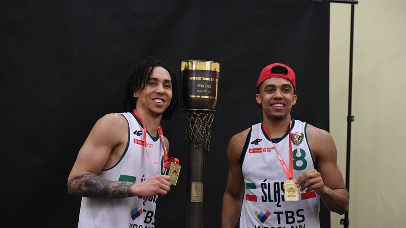 Travis Trice, left, and D'Mitrik Trice pose for a photo with the championship trophy after helping lead WKS Śląsk Wrocław to a championship in Poland. Photo courtesy of WKS Śląsk Wrocław