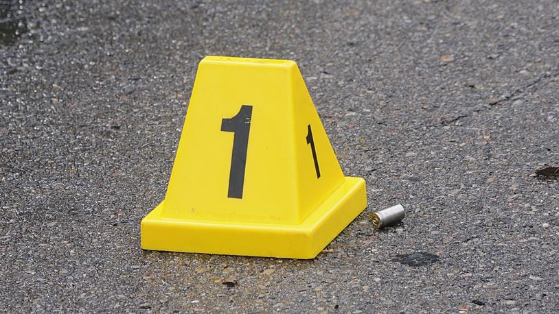 Police placed evidence markers where spent shell casings were found along the west side of North Main Street at West Shadyside Drive, Dayton Monday May 9, 2016. (Marshall Gorby/Staff)