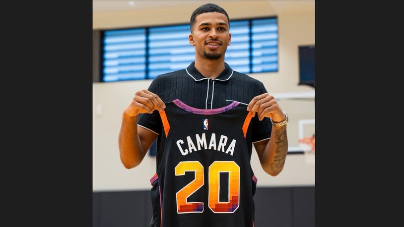 Toumani Camara poses for a photo with a Suns jersey in Phoenix, Ariz., on Tuesday, June 27, 2023. Photo courtesy of the Phoenix Suns.