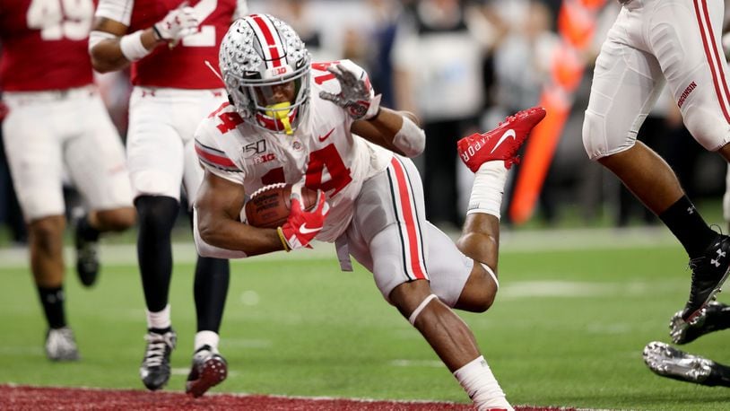 INDIANAPOLIS, INDIANA - DECEMBER 07: K.J. Hill #14 of the Ohio State Buckeyes runs the ball in for touchdown in the Big Ten Championship game against the Wisconsin Badgers during the third quarter at Lucas Oil Stadium on December 07, 2019 in Indianapolis, Indiana. (Photo by Justin Casterline/Getty Images)