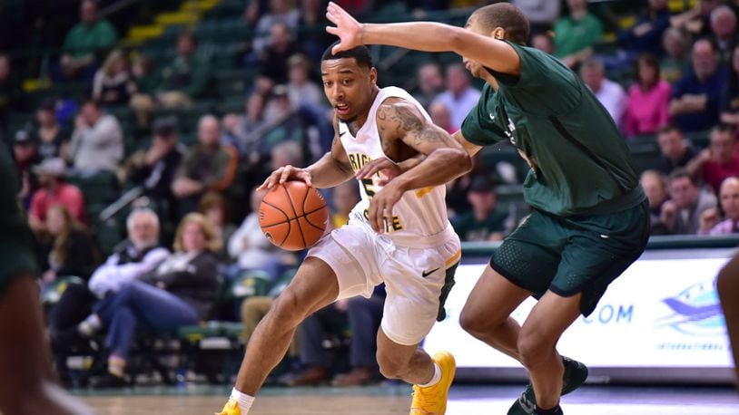 Wright State’s Skyelar Potter drives by a Cleveland State defender during Thursday night’s game at the Nutter Center. Joseph Craven/CONTRIBUTED