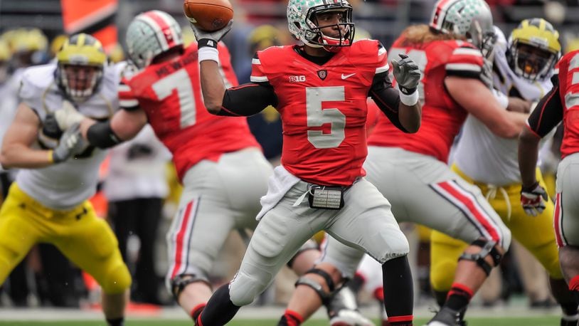 COLUMBUS, OH - NOVEMBER 24: Quarterback Braxton Miller #5 of the Ohio State Buckeyes controls the ball against the Michigan Wolverines at Ohio Stadium on November 24, 2012 in Columbus, Ohio. (Photo by Jamie Sabau/Getty Images)
