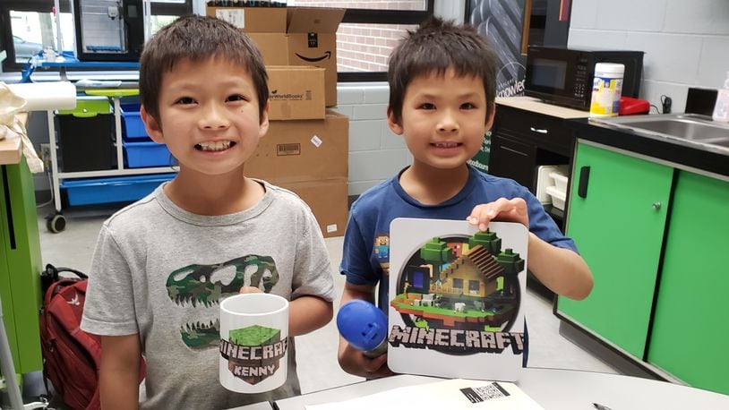 Children create a Minecraft mug and sign via the new Creativity Commons inside Washington Twp. RecPlex on Thursday, June 16, 2022. The makerspace initiative is powered by Washington Twp.-Centerville Public Library and takes place in 800 square feet of leased space within the RecPlex. CONTRIBUTED