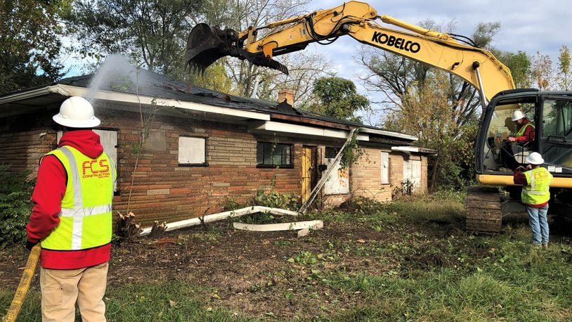 A crew with FCS Construction Services Inc. on Thursday torn down a home on the 1000 block of Roseland Avenue in the Westwood neighborhood. CORNELIUS FROLIK / STAFF