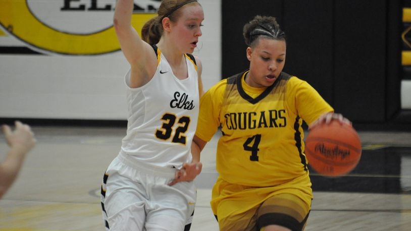 Centerville guard Sam Chable ramps up the defensive pressure on Kenton Ridge’s Desiree Jones during the Elks’ 63-54 victory last week. NICK DUDUKOVICH / CONTRIBUTED