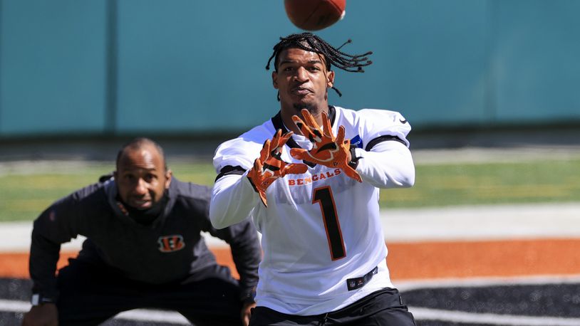 Cincinnati Bengals wide receiver Ja'Marr Chase (1) makes a catch during an NFL football rookie minicamp in Cincinnati, Friday, May 14, 2021. (AP Photo/Aaron Doster)