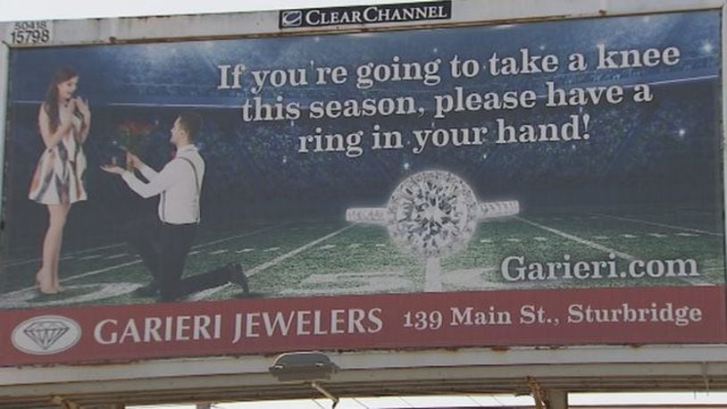A Massachusetts jeweler is sparking controversy with a billboard that strikes back at take a knee protests in the NFL.