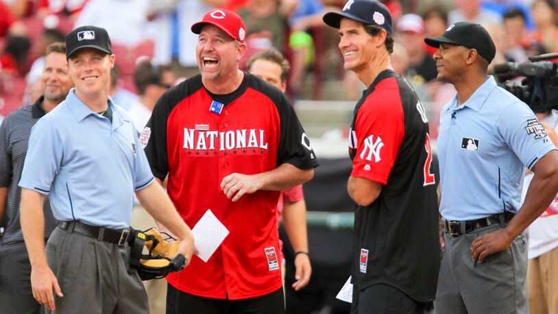 Former Reds players Sean Casey and Paul O’Neill meet at home plate before the start of the All-Star Legends & Celebrity Softball Game held at Great American Ballpark, Sunday, July 12, 2015. GREG LYNCH / STAFF