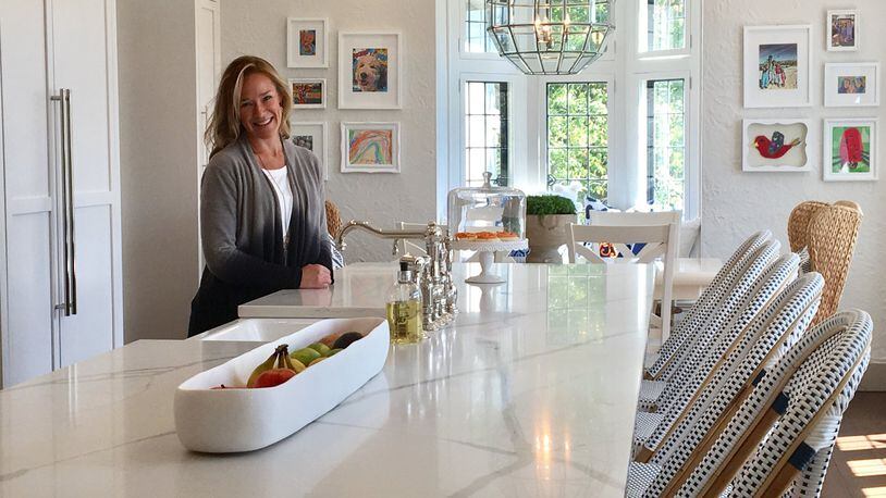 Alison Davis recently remodeled her kitchen in her Oakwood home on Ridgeway Road. Davis said she spent a year planning her kitchen renovation and was therefore able to avoid some of the trouble she ran into trying to quickly get through bathroom renovations in her house.