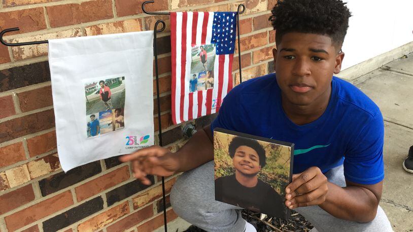 Hodges Clemmons, 15, and his 8-year-old sister Ziah made lawn displays memorializing their older brother Antoine Jones who was shot to death last year. Their mother Carolyn Williams was denied victims compensation funds because Jones was allegedly involved in drug dealing when he was killed. She says she and Jones’ siblings are also victims, and should qualify for help with counseling costs and burial costs.