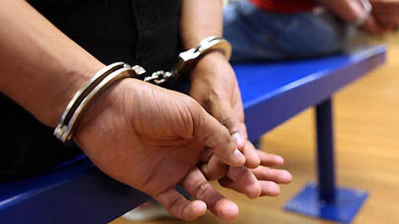 In this photo proved by U.S. Immigration and Customs Enforcement (ICE), an unidentified immigrant are processed after being taken into custody on Sept. 8, 2012 in Dallas. Following a five-day Texas-wide ICE operation, 50 convicted alien sex offenders and other criminal aliens were arrested by officers with ICEs Enforcement and Removal Operations (ERO), and the Texas Department of Public Safety (DPS). (AP Photo, ICE)