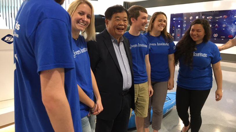 Fuyao Global Chairman Cho Tak Wong met some University of Dayton river stewards Wednesday. The students will travel to China in less than a month. THOMAS GNAU/STAFF