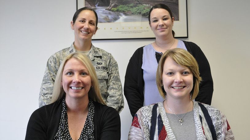 The new Wright-Patterson Air Force Base Sexual Assault Prevention and Response team includes (top left to right): Capt. Morgan Griffo, deputy sexual assault response coordinator; Annamae Willis, SAPR specialist and full-time victim advocate. Bottom left to right: April Barrows, Wright-Patterson Air Force Base installation SARC and SAPR program manager; Stephanie Wilson, SAPR specialist and full-time victim advocate. April is Sexual Assault Awareness and Prevention Month. The SAPR office will host various activities throughout the base to highlight care for victims and prevention practices. (U.S. Air Force photo/Myra Saxon).