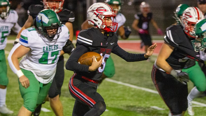 Tippecanoe quarterback Peyton Schultz runs for a first down against Chaminade-Julienne on Friday night. Jeff Gilbert/CONTRIBUTED