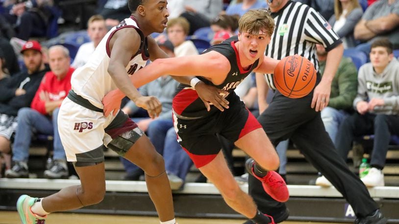 Preble Shawnee's Mason Shrout drives past a Harvest Prep defender during the Division III regional final game Saturday, March 11, 2023 at Trent Arena in Kettering. Preble Shawnee lost to Canal Winchester Harvest Prep 56-49. CONTRIBUTED PHOTO BY MICHAEL COOPER