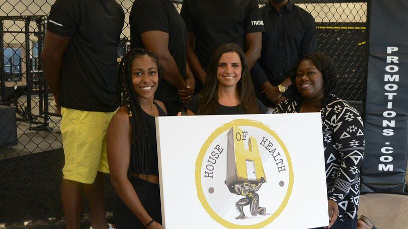 The House of Health is a local gym that are inspired by charity and community. Pictured are some of the members of the House of Health team: (back, from left) Mo Abdullah, Tyrome Bembry, Zo Allen, Lonnel Williams; (front, from left) Courtney Tucky, Christina Shteiwi and Chalet Wilkns. Not pictured are A.J. Williams and Carlos Davis. MICHAEL D. PITMAN/STAFF