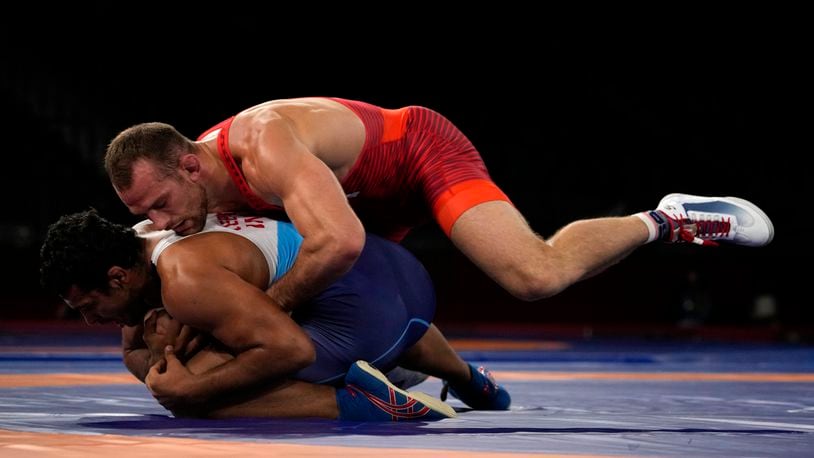 David Morris Taylor III, top, of the United States, and India's Deepak Punia compete in the men's 86kg Freestyle semifinal wrestling match at the 2020 Summer Olympics, Wednesday, Aug. 4, 2021, in Chiba, Japan. (AP Photo/Aaron Favila)
