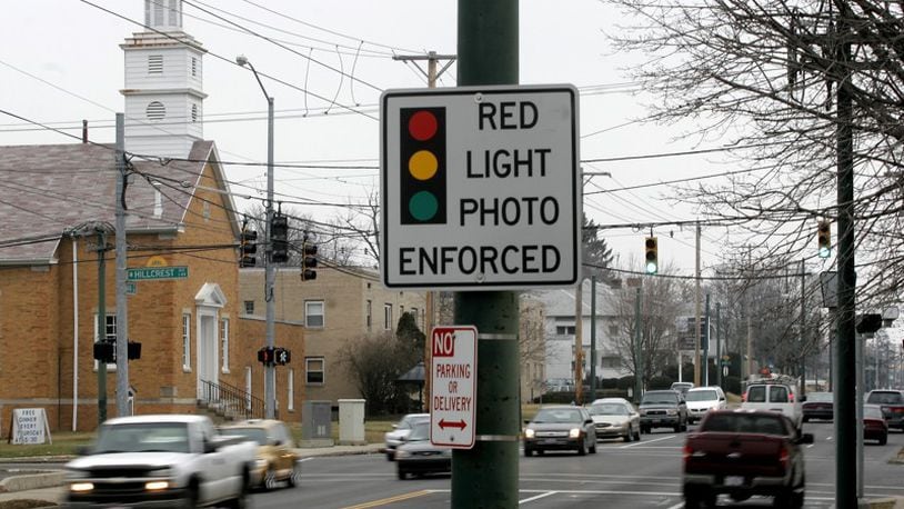 A sign warning of red light cameras near the Hillcrest Avenue intersection. STAFF