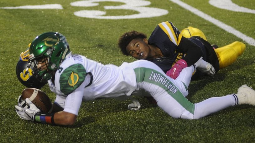 Springfield’s Kedric Holt loses his helmet while tackling Northmont’s Drake Hickman. Northmont defeated host Springfield 22-10 in a Week 7 GWOC crossover game on Friday, Oct. 6, 2017. MARC PENDLETON / STAFF