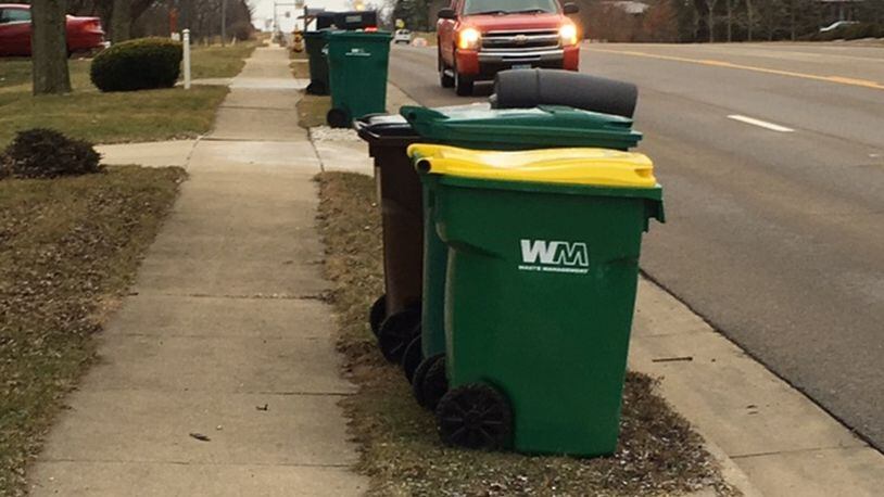 New exterior property maintenance rules that include fines of up to $1,000 in Miami Twp. are aimed at chronic violators. The new guidelines address how long and when trash containers can be at a curb. NICK BLIZZARD/STAFF