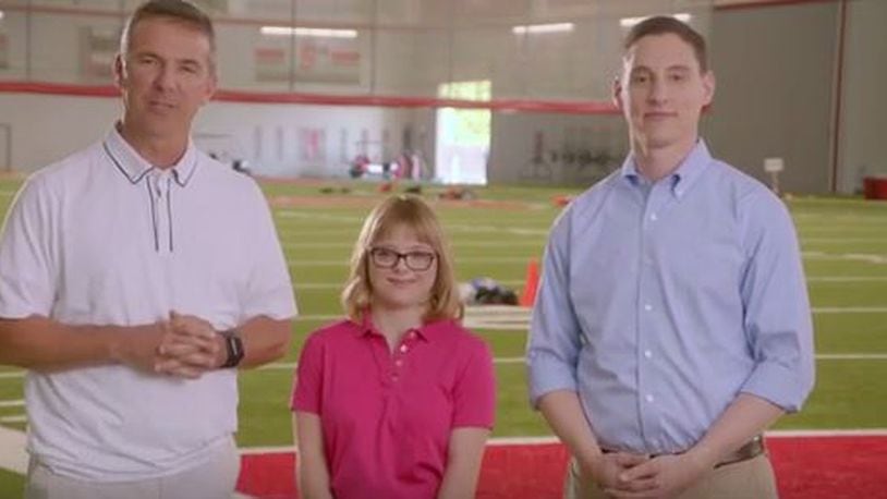 Ohio Treasurer Josh Mandel appears with Ohio State University football coach Urban Meyer touting STABLE savings accounts for people with special needs children.