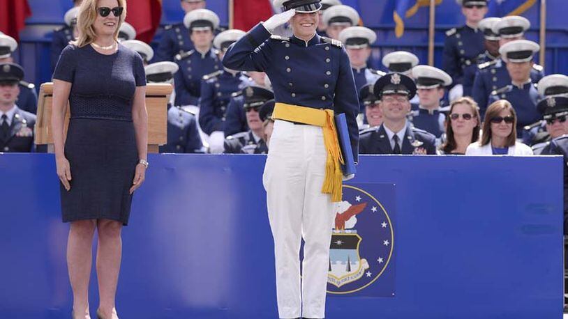 Alter High grad Rebecca Esselstein salutes her Air Force Academy class during the graduation ceremony on May 28, 2015. The woman (left) on stage with her is Deborah James, who was the secretary of the Air Force at that time. CONTRIBUTED